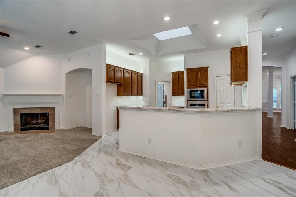 901 Autumn Ridge Drive McKinney, TX 75072 - Photo 24 of 24 a living room with fireplace furniture and a flat screen tv
