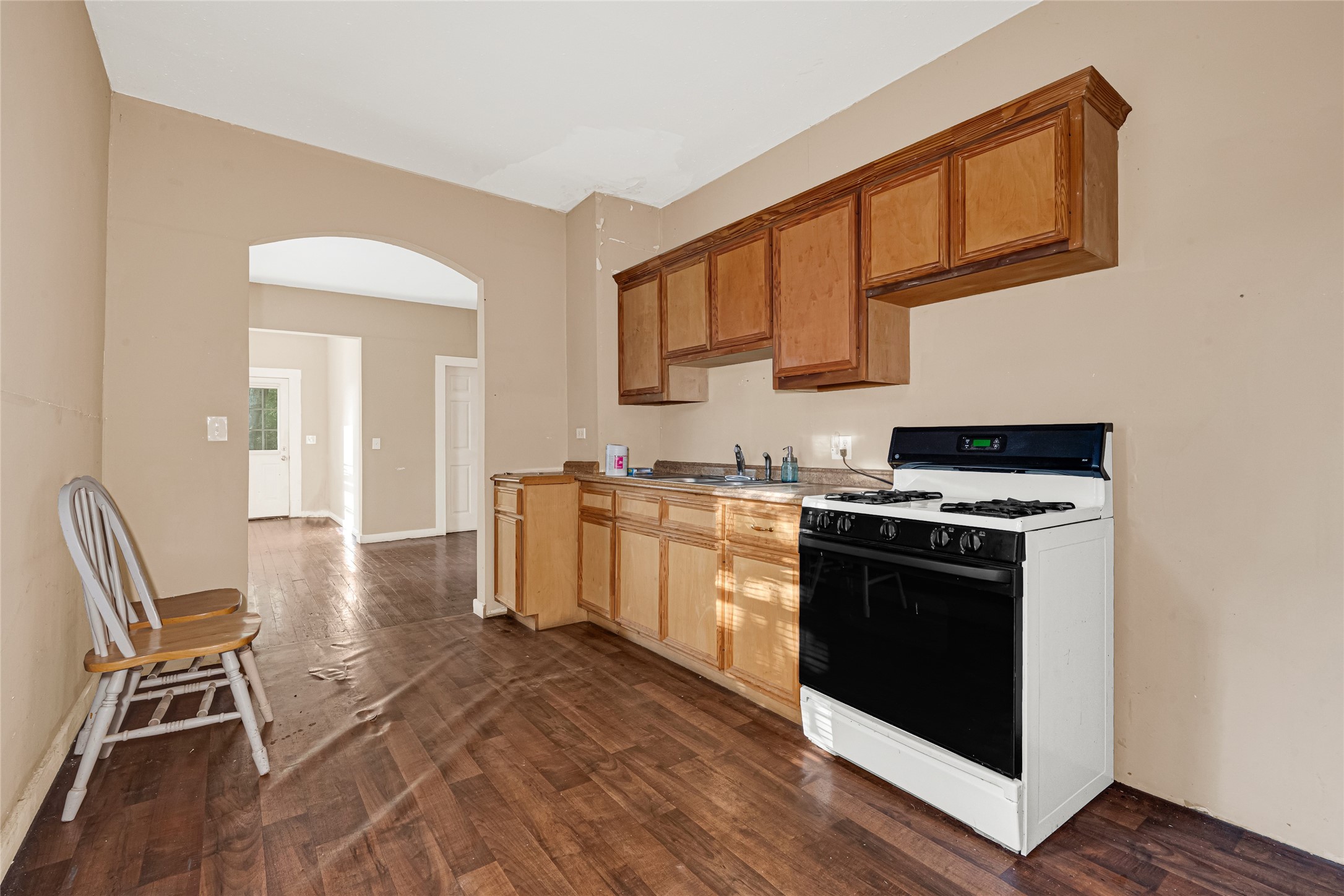 7305 Tremper Street Houston, TX 77020 - Photo 10 of 28 a kitchen with stainless steel appliances granite countertop a stove and a sink
