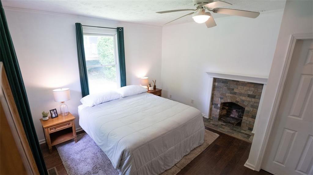 2881 Parrott Avenue Northwest Atlanta, GA 30318 - Photo 17 of 32 a bedroom with a bed and a mirror