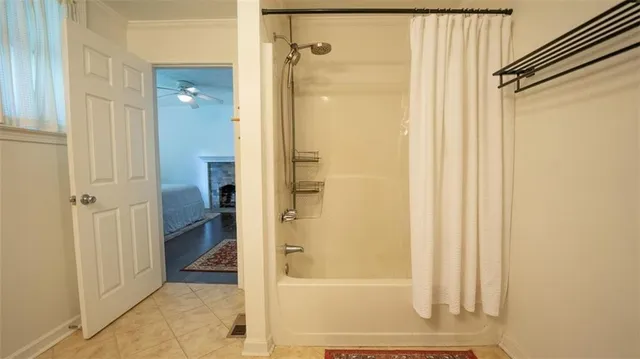 a bathroom with a glass shower door