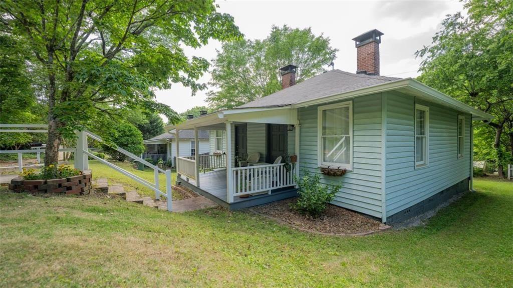 2881 Parrott Avenue Northwest Atlanta, GA 30318 - Photo 2 of 32 a front view of a house with a yard