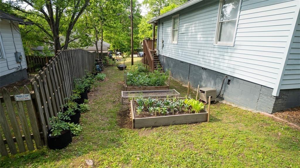 2881 Parrott Avenue Northwest Atlanta, GA 30318 - Photo 28 of 32 a view of a backyard with wooden fence