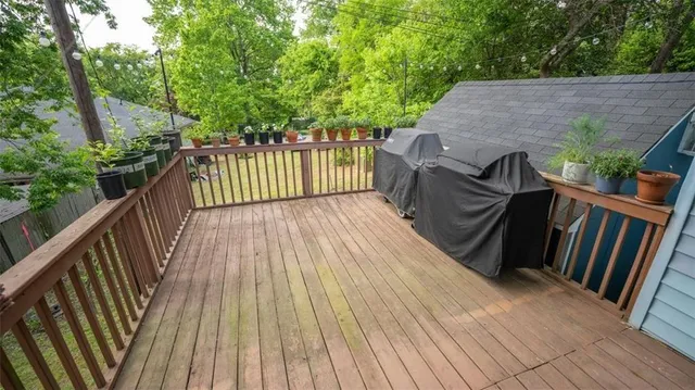 a view of deck with wooden floor and outdoor seating