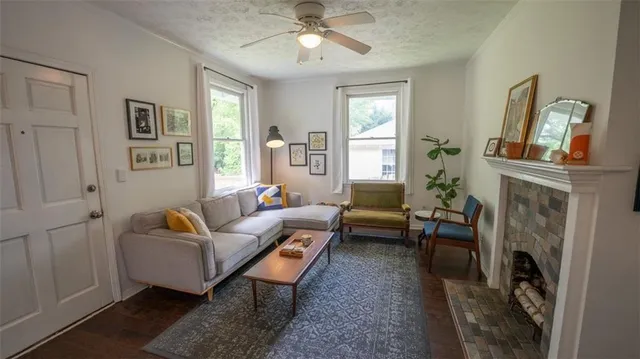 a living room with furniture and a fireplace
