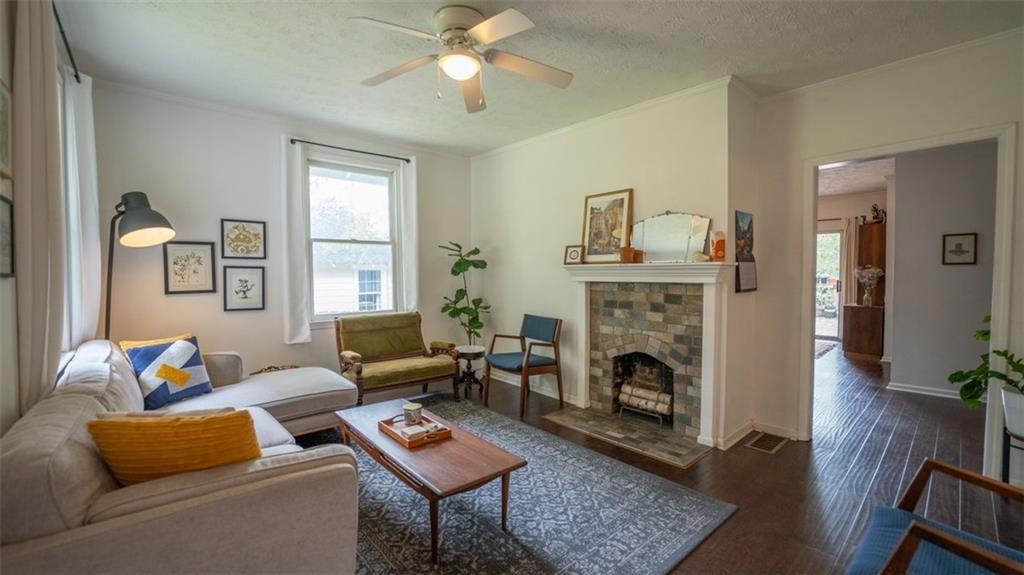 2881 Parrott Avenue Northwest Atlanta, GA 30318 - Photo 6 of 32 a living room with furniture fireplace and window
