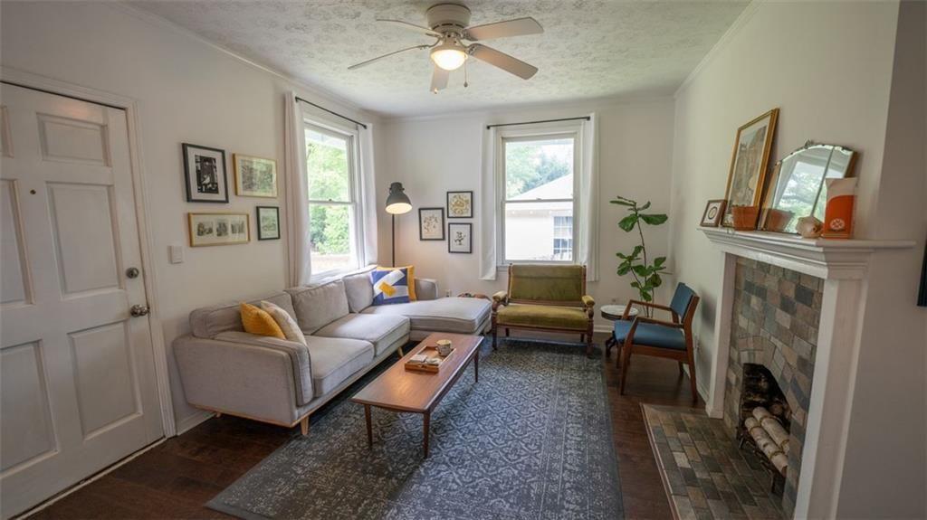 2881 Parrott Avenue Northwest Atlanta, GA 30318 - Photo 7 of 32 a living room with furniture and a fireplace