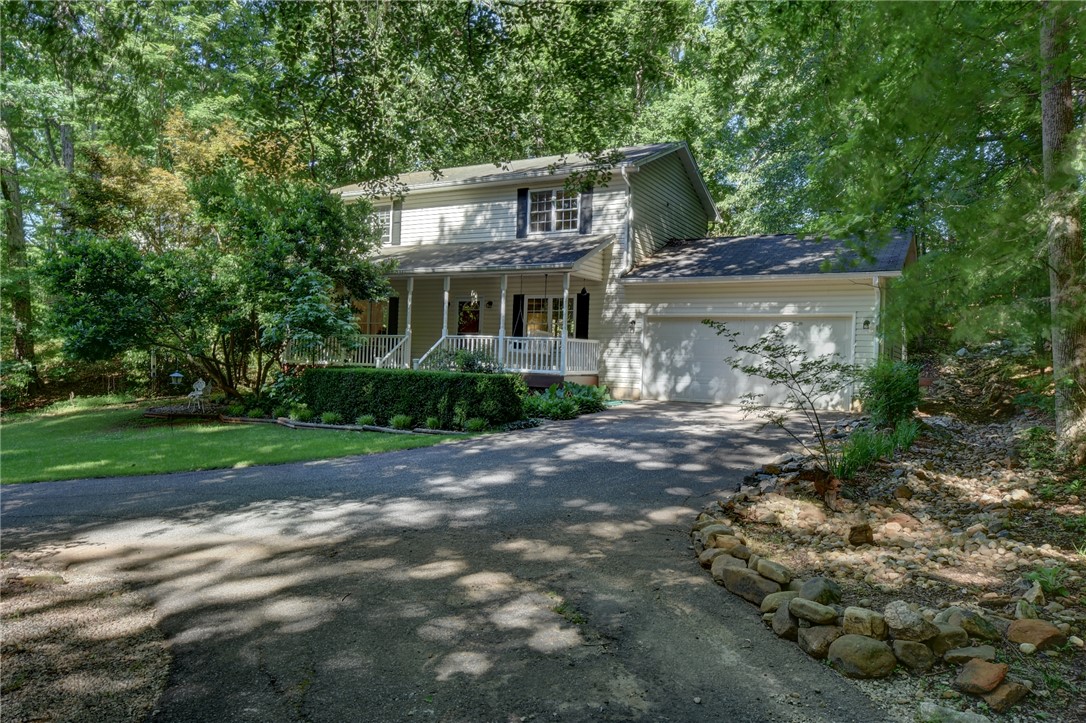 2011 Ridgeview Lane Seneca, SC 29678 - Photo 1 of 1 This classic suburban home offers a welcoming facade with a paved driveway and mature trees.