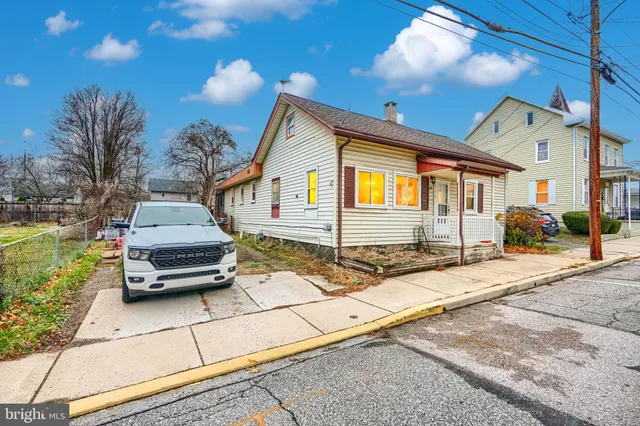 a car parked in front of a house