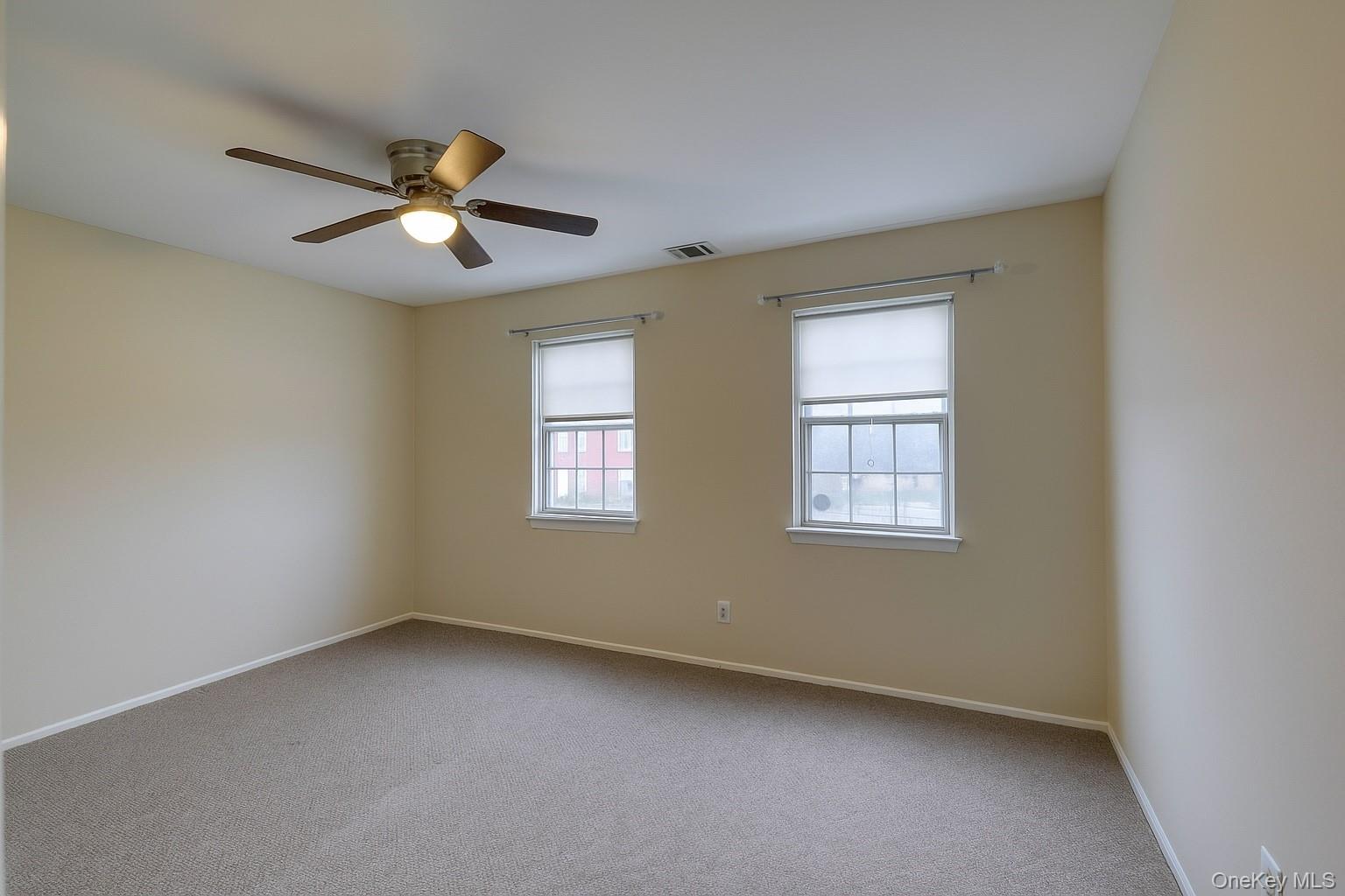 7 Weathervane Way Warwick, NY 10990 - Photo 13 of 21 an empty room with a window and a fan