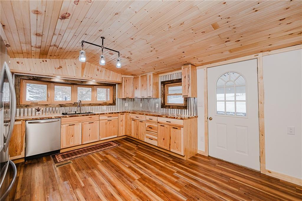 42 Gress Road Creekside, PA 15732 - Photo 11 of 41 a large kitchen with stainless steel appliances granite countertop a lot of counter space and a wooden floors