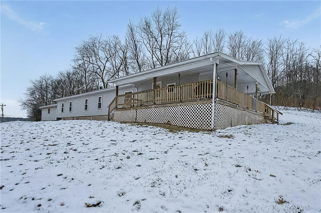 42 Gress Road Creekside, PA 15732 - Photo 2 of 41 a front view of a house with a yard and trees