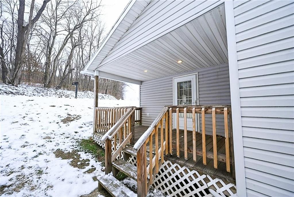 42 Gress Road Creekside, PA 15732 - Photo 3 of 41 a view of a balcony with wooden floor and fence