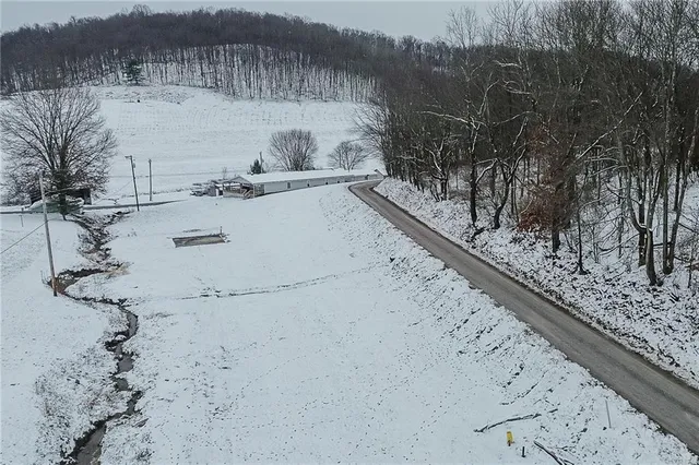 a view of roof with wooden floor and outdoor seating