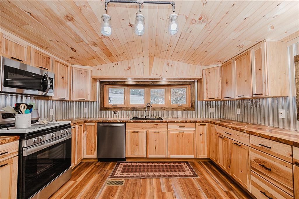 42 Gress Road Creekside, PA 15732 - Photo 8 of 41 a kitchen with stainless steel appliances a stove sink and cabinets