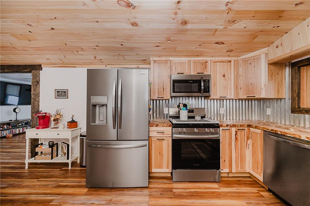 42 Gress Road Creekside, PA 15732 - Photo 10 of 41 a kitchen with stainless steel appliances granite countertop a stove and a refrigerator