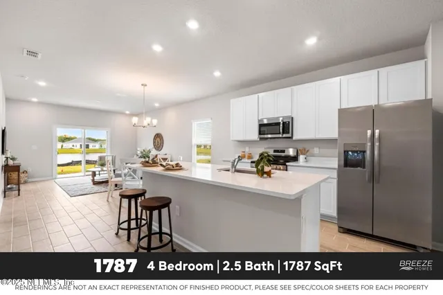 a kitchen with a sink a counter top space stainless steel appliances and cabinets