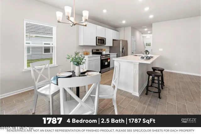 a kitchen with a table chairs refrigerator and microwave