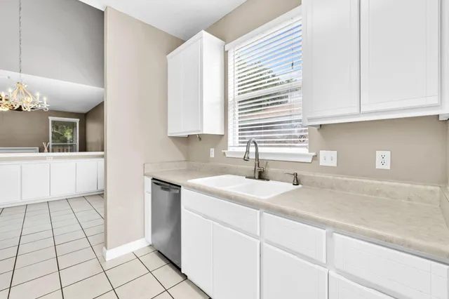 wooden floor with chandelier fan in a room