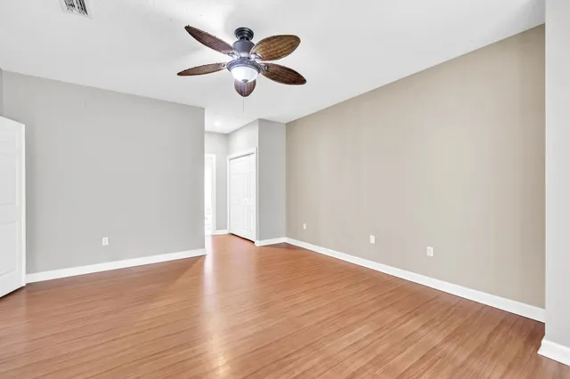 a view of a hallway with a wooden door