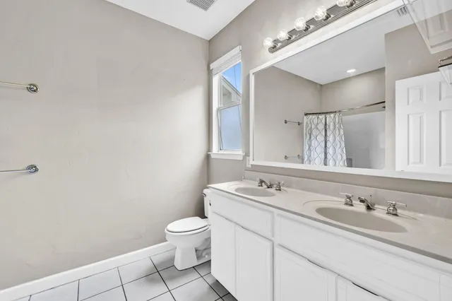 a bathroom with a shower curtain and a shower curtain