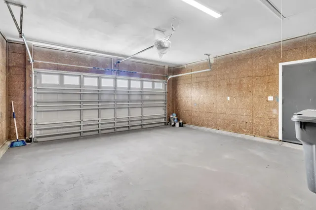 a view of a house with backyard and porch