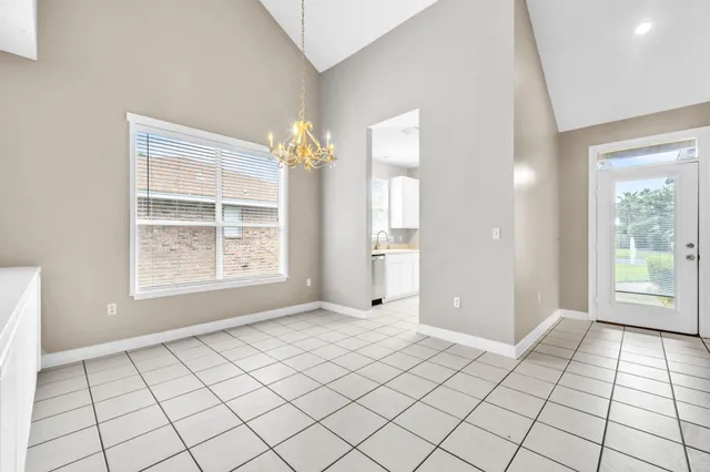 a spacious bathroom with a sink mirror and vanity