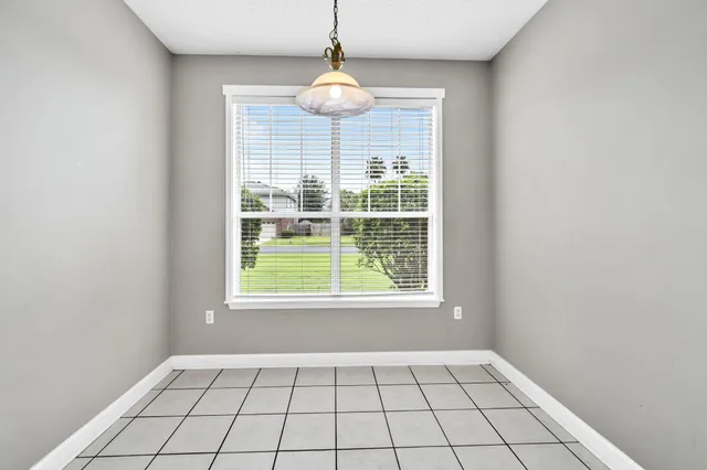 a bathroom with a walk in closet and wooden floor