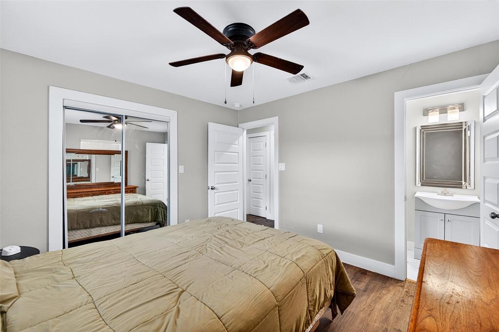 604 East Summit Street Sherman, TX 75090 - Photo 14 of 30 a bedroom with a bed and a large window