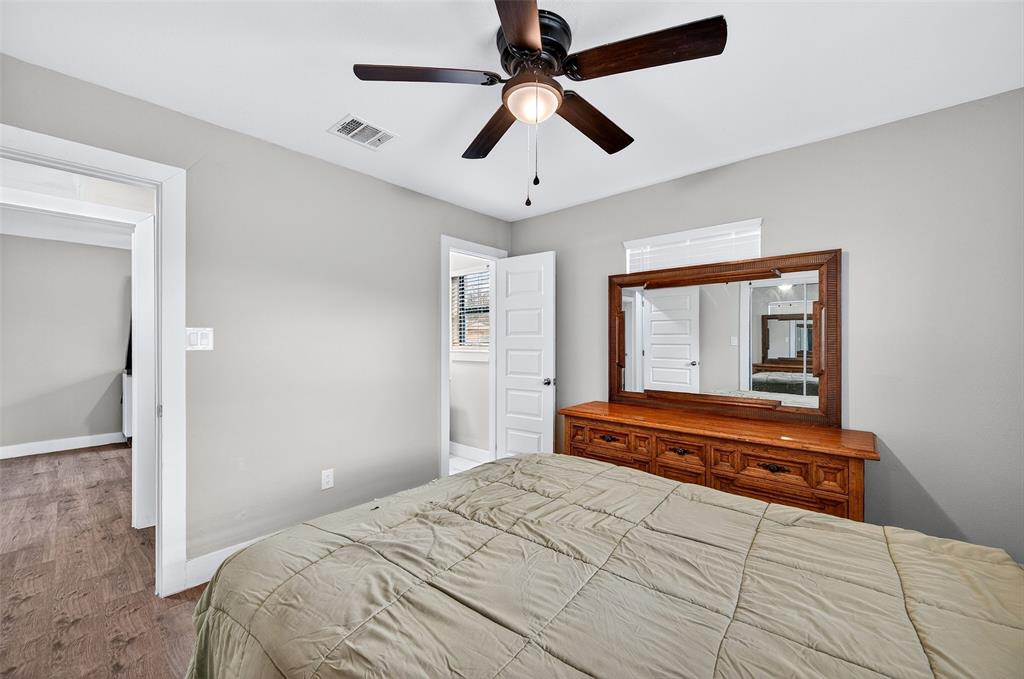 604 East Summit Street Sherman, TX 75090 - Photo 15 of 30 a bedroom with a bed and a large mirror
