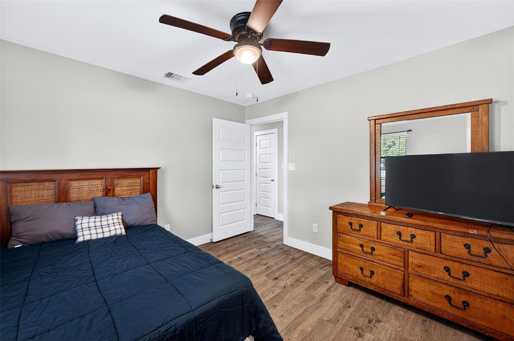 604 East Summit Street Sherman, TX 75090 - Photo 18 of 30 a bedroom with furniture and a flat screen tv