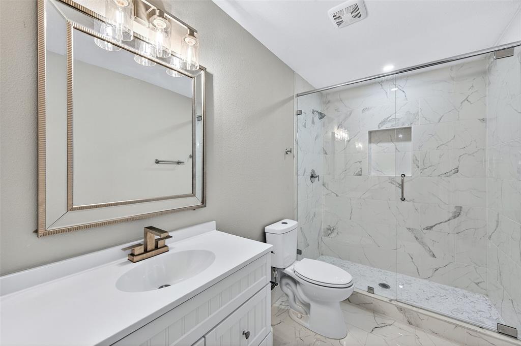 604 East Summit Street Sherman, TX 75090 - Photo 24 of 30 a bathroom with a sink toilet and shower
