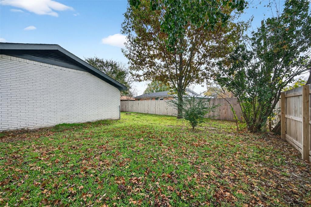 604 East Summit Street Sherman, TX 75090 - Photo 30 of 30 a backyard of a house with lots of green space
