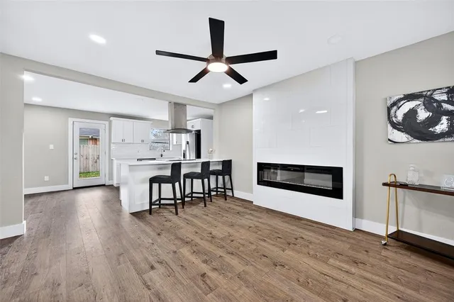 a view of a kitchen with a table and chairs