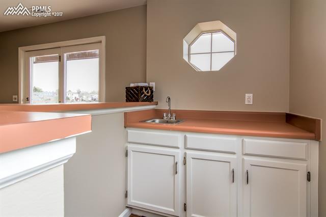 6110 Rabbit Ears Court Colorado Springs, CO 80919 - Photo 19 of 32 Wet Bar