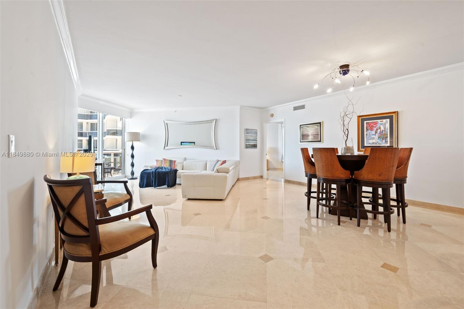 9595 Collins Avenue, Unit N7D Surfside, FL 33154 - Photo 11 of 32 a view of a dining room with furniture