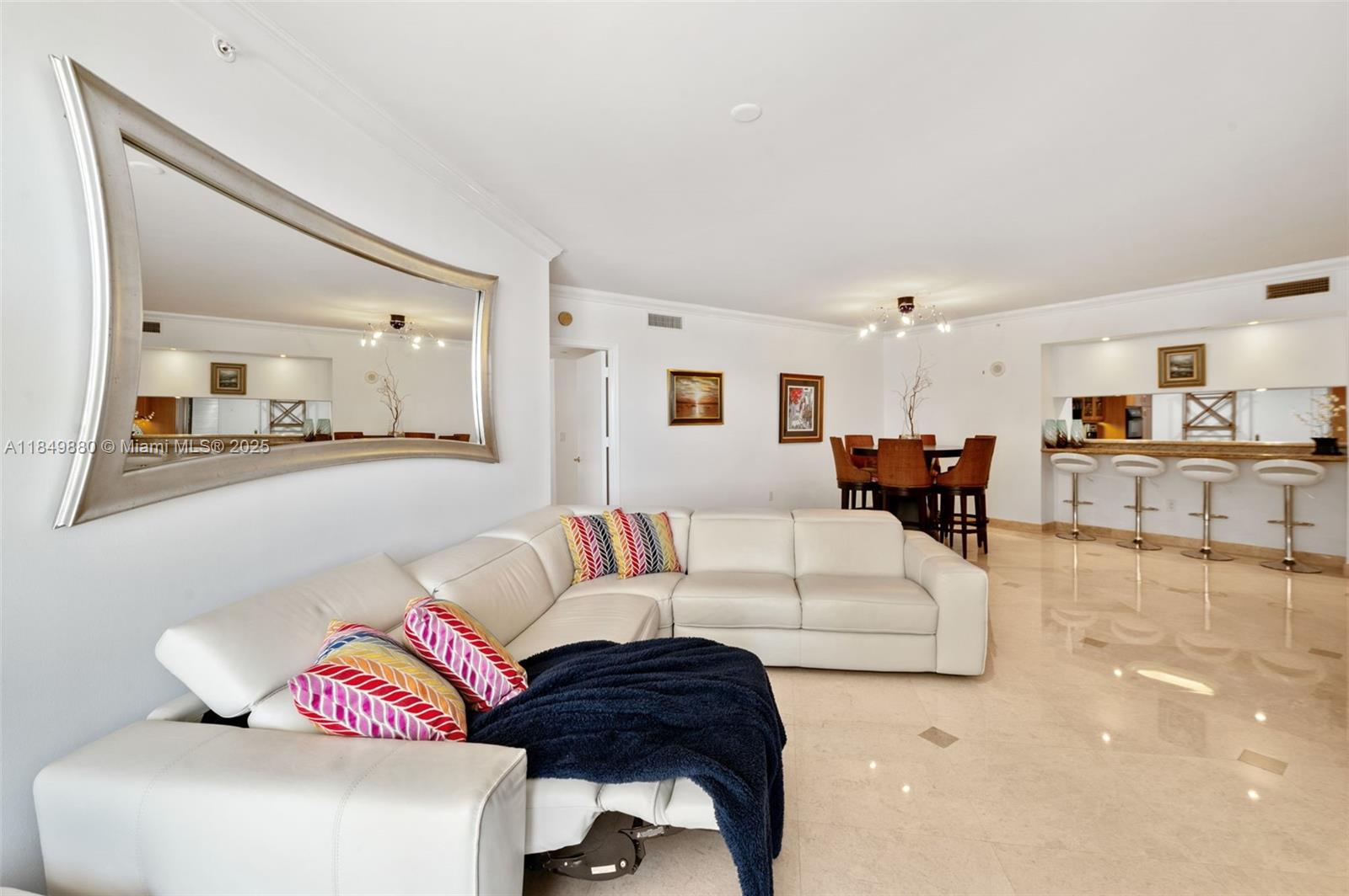 9595 Collins Avenue, Unit N7D Surfside, FL 33154 - Photo 13 of 32 a living room with furniture and a view of kitchen