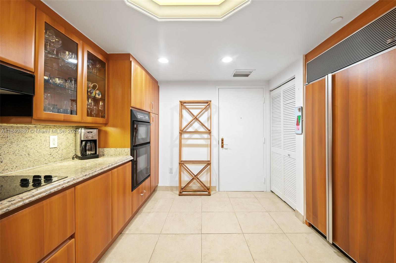 9595 Collins Avenue, Unit N7D Surfside, FL 33154 - Photo 17 of 32 a large kitchen with stainless steel appliances granite countertop a refrigerator and a sink
