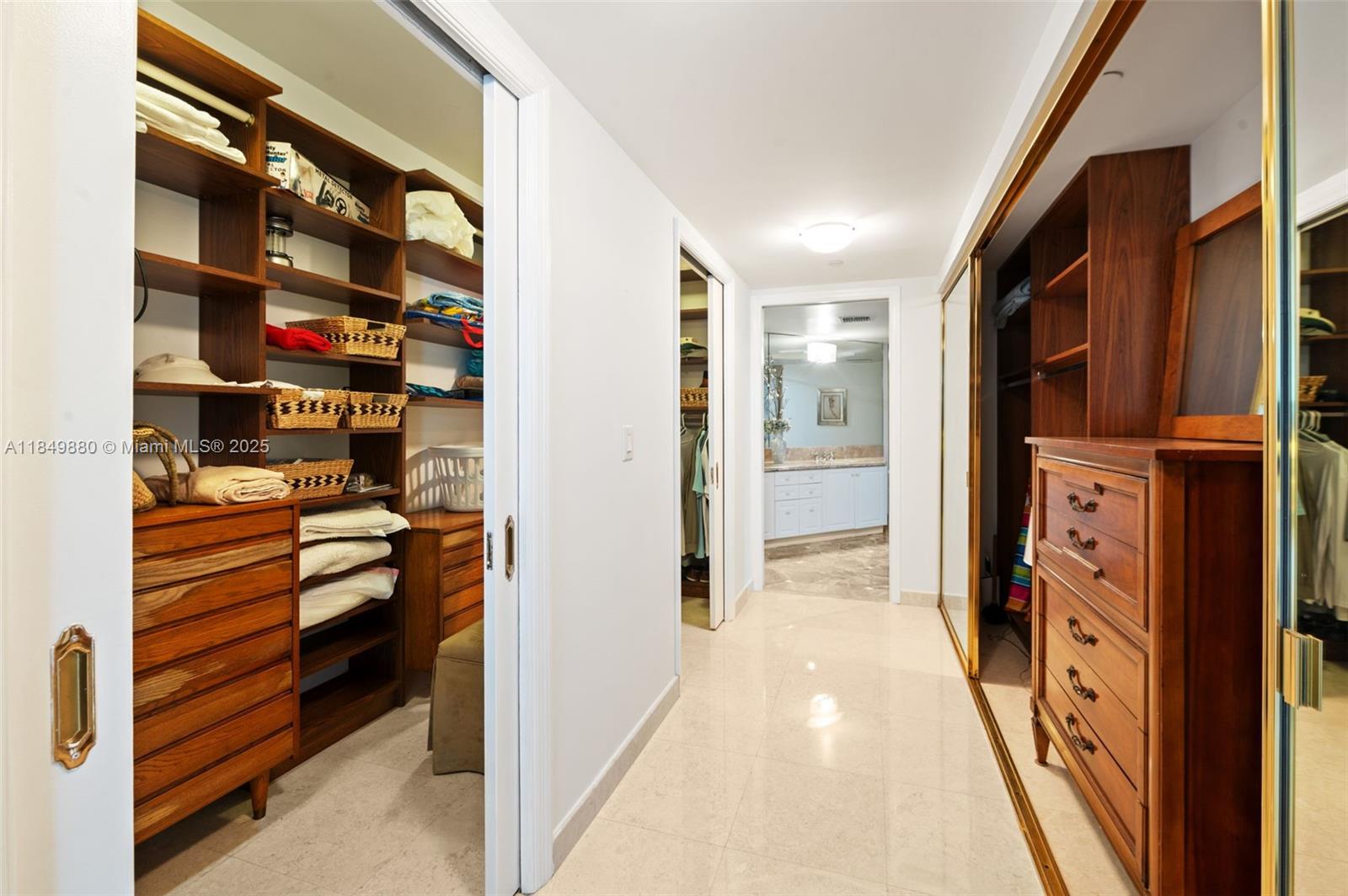 9595 Collins Avenue, Unit N7D Surfside, FL 33154 - Photo 22 of 32 a view of walk in closet with clothes and shoes