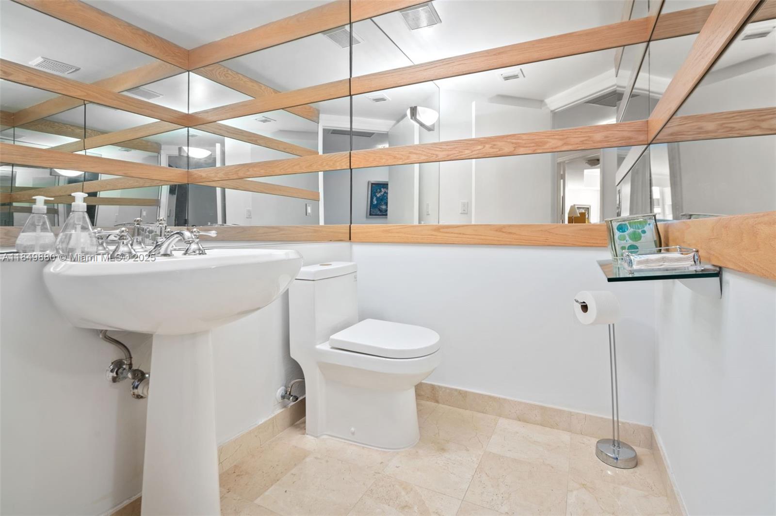 9595 Collins Avenue, Unit N7D Surfside, FL 33154 - Photo 24 of 32 a bathroom with a sink mirror toilet and shower