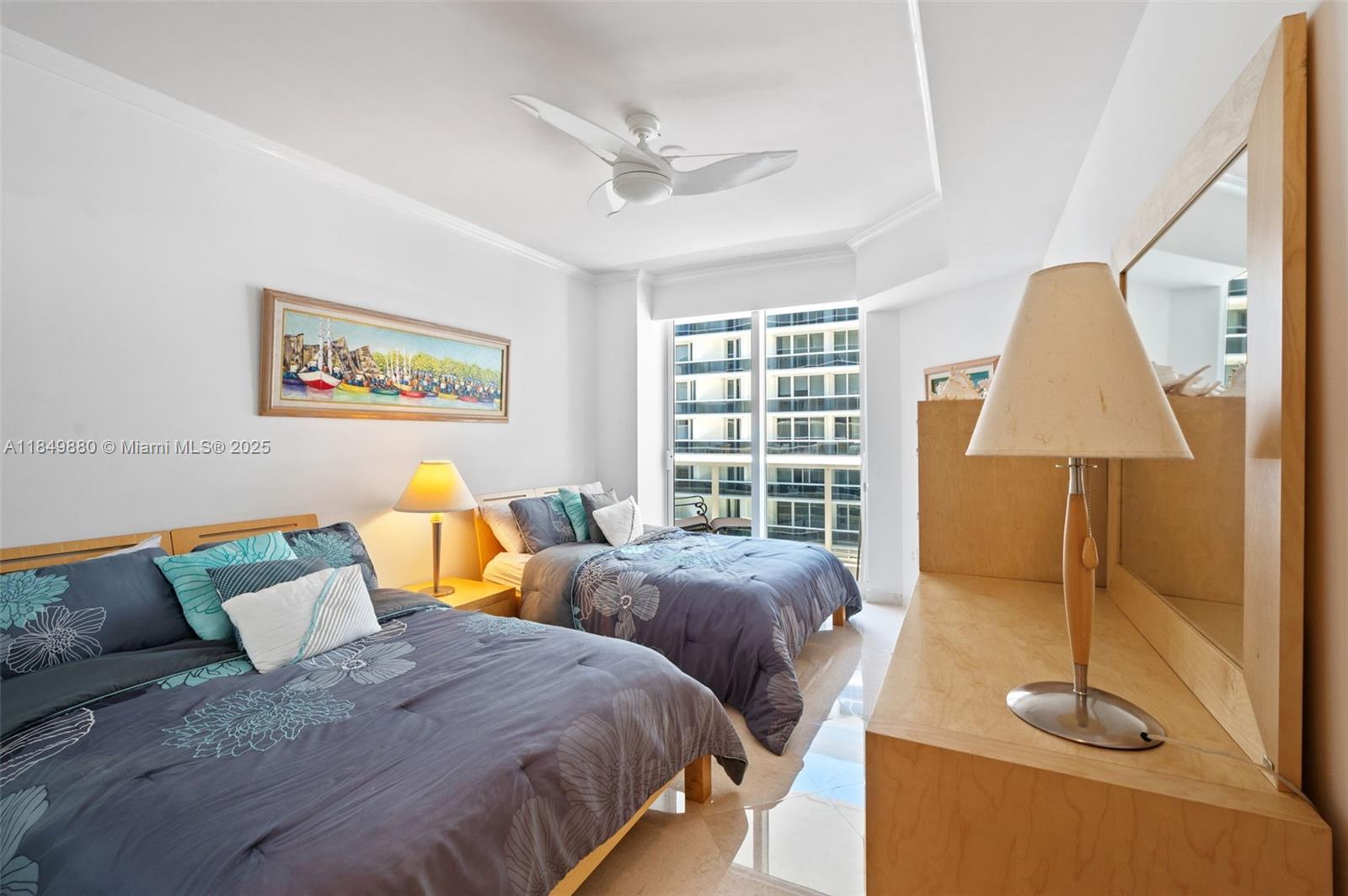 9595 Collins Avenue, Unit N7D Surfside, FL 33154 - Photo 26 of 32 a bedroom with two beds and a table