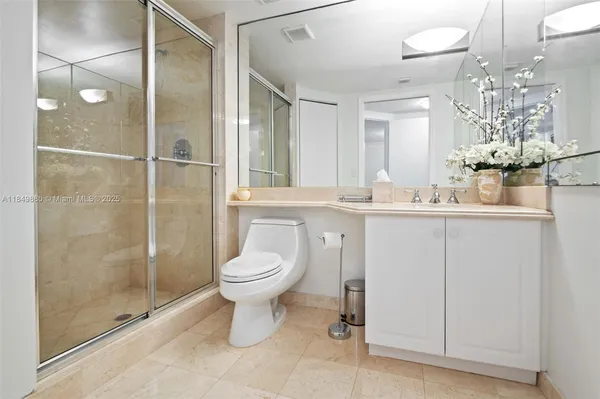 a view of a swimming pool with outdoor seating and plants