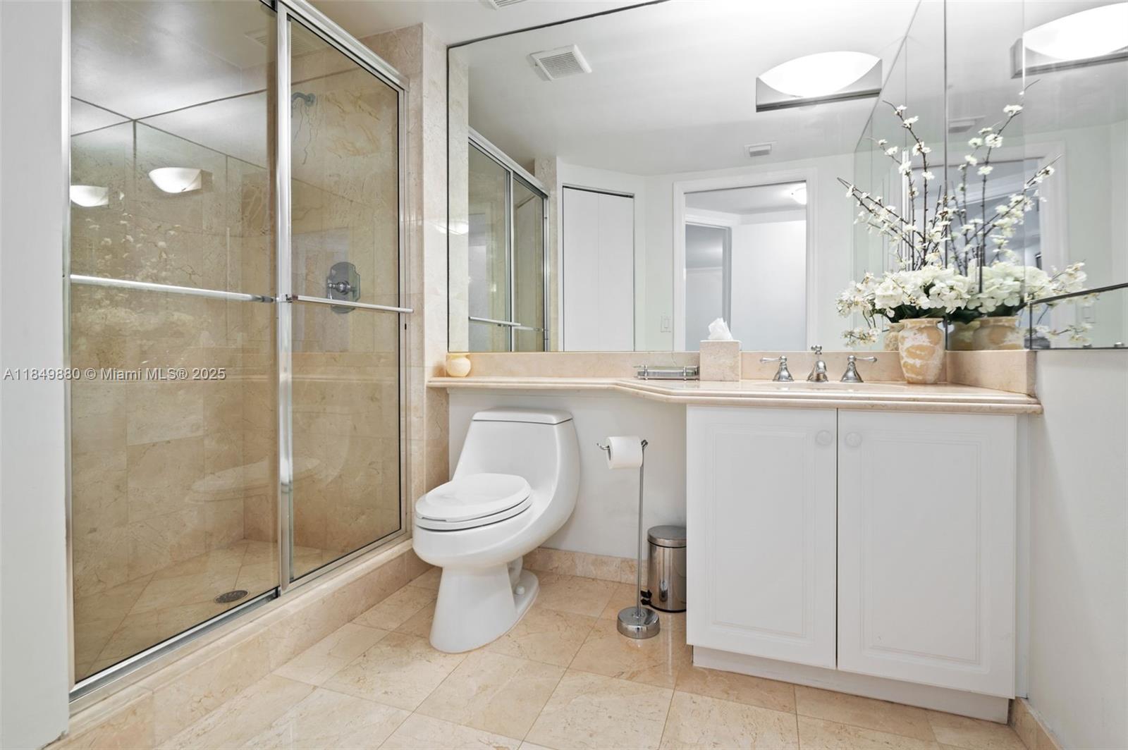 9595 Collins Avenue, Unit N7D Surfside, FL 33154 - Photo 29 of 32 a bathroom with a toilet sink and shower