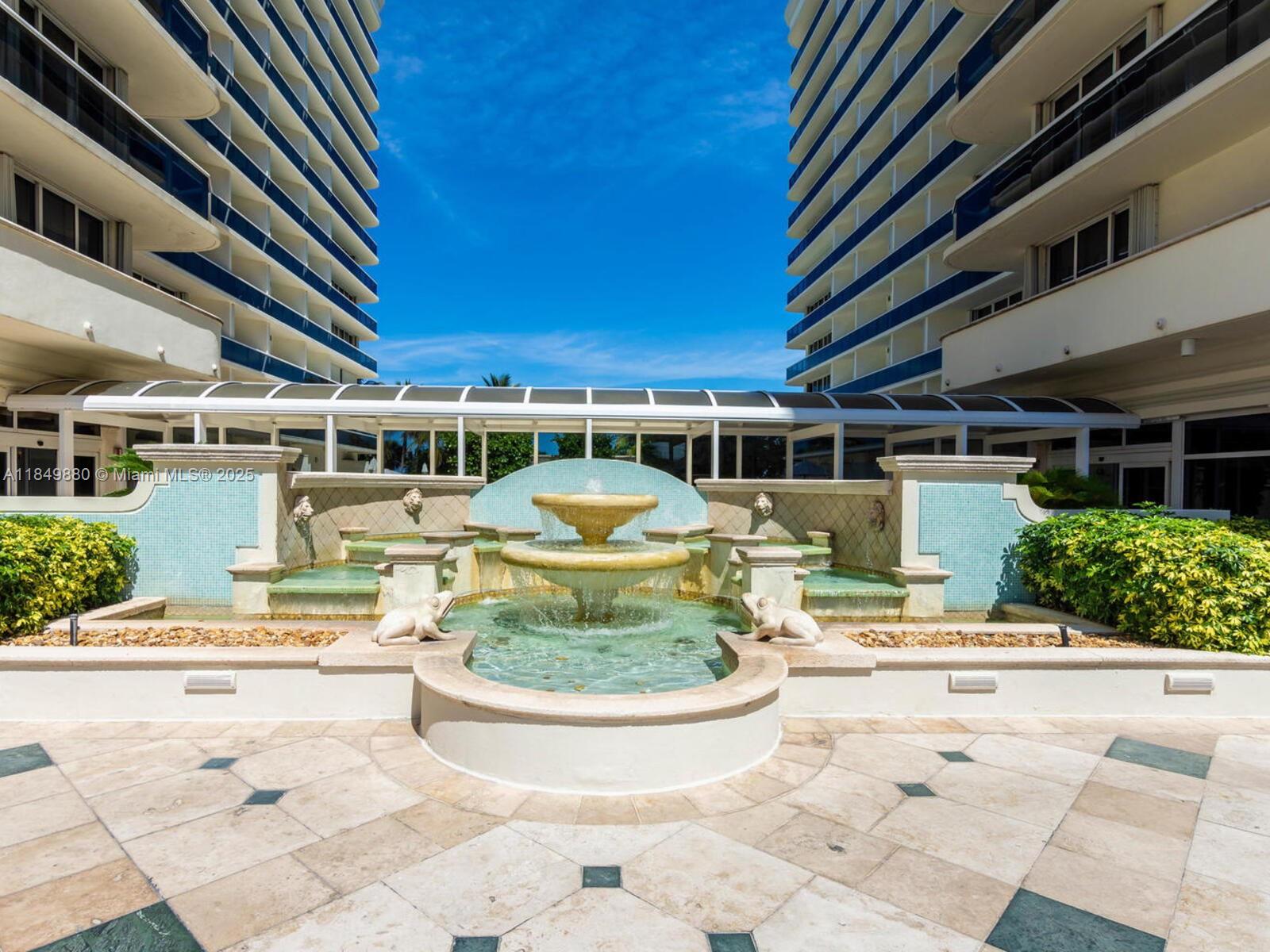 9595 Collins Avenue, Unit N7D Surfside, FL 33154 - Photo 4 of 32 a view of a swimming pool with a patio