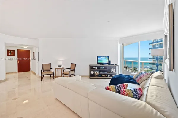 a room with furniture and a flat screen tv