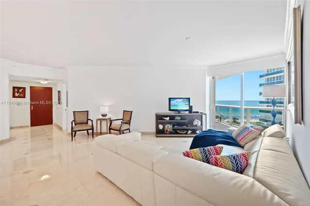 a room with furniture and a flat screen tv