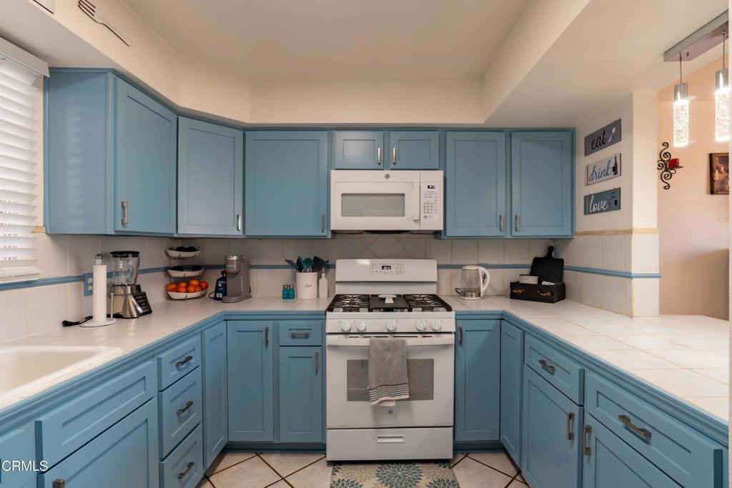 635 East Pleasant Valley Road Port Hueneme, CA 93041 - Photo 8 of 17 a kitchen with a sink stove and cabinets
