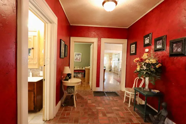 a kitchen with granite countertop a sink a counter top stainless steel appliances and cabinets