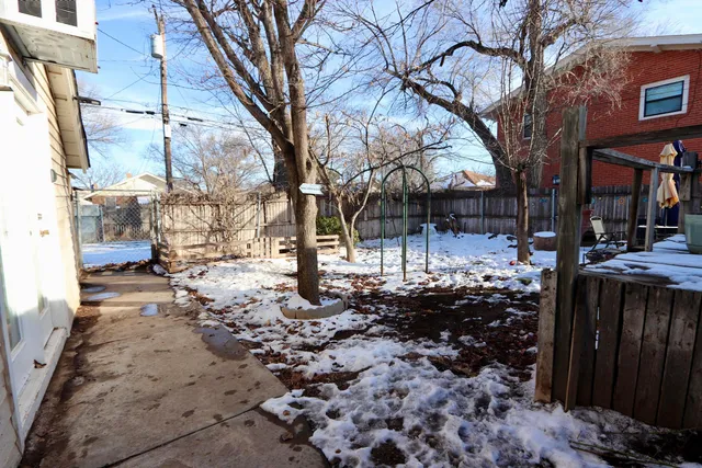 a room with pool table and windows