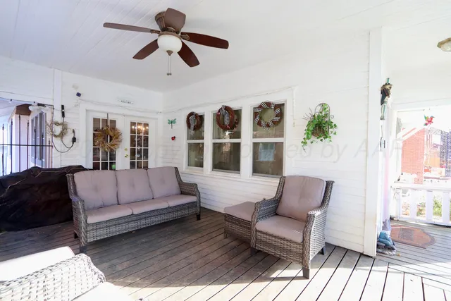 a living room with furniture fireplace and flat screen tv