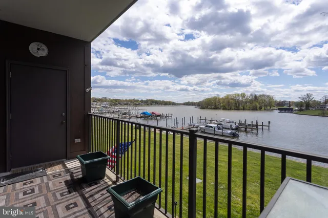 a view of a balcony with two chairs